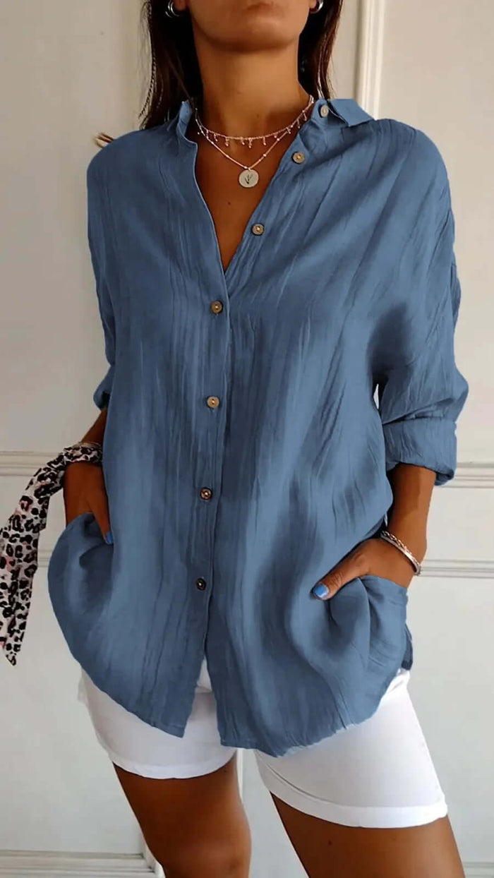 Womens Lapel Long Sleeve Single Breasted Pleated Shirt in blue, featuring buttons and pockets, styled with white shorts.