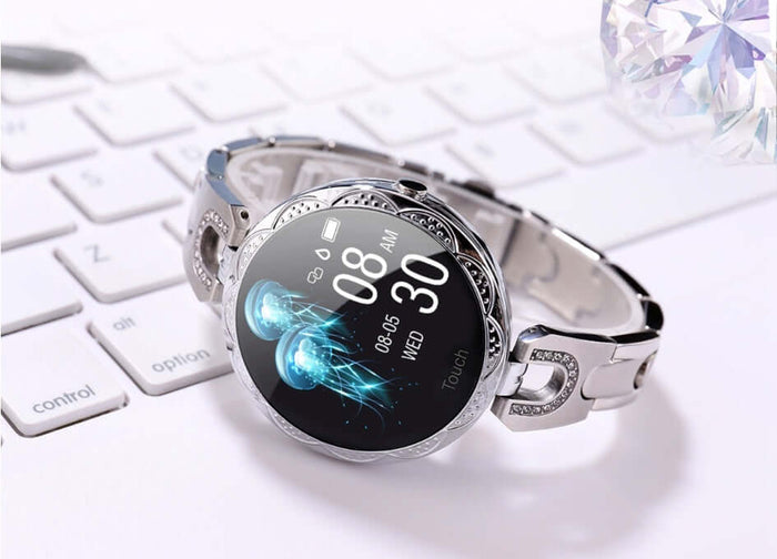 Womens Waterproof Fashion Smartwatch on a keyboard displaying health monitoring features